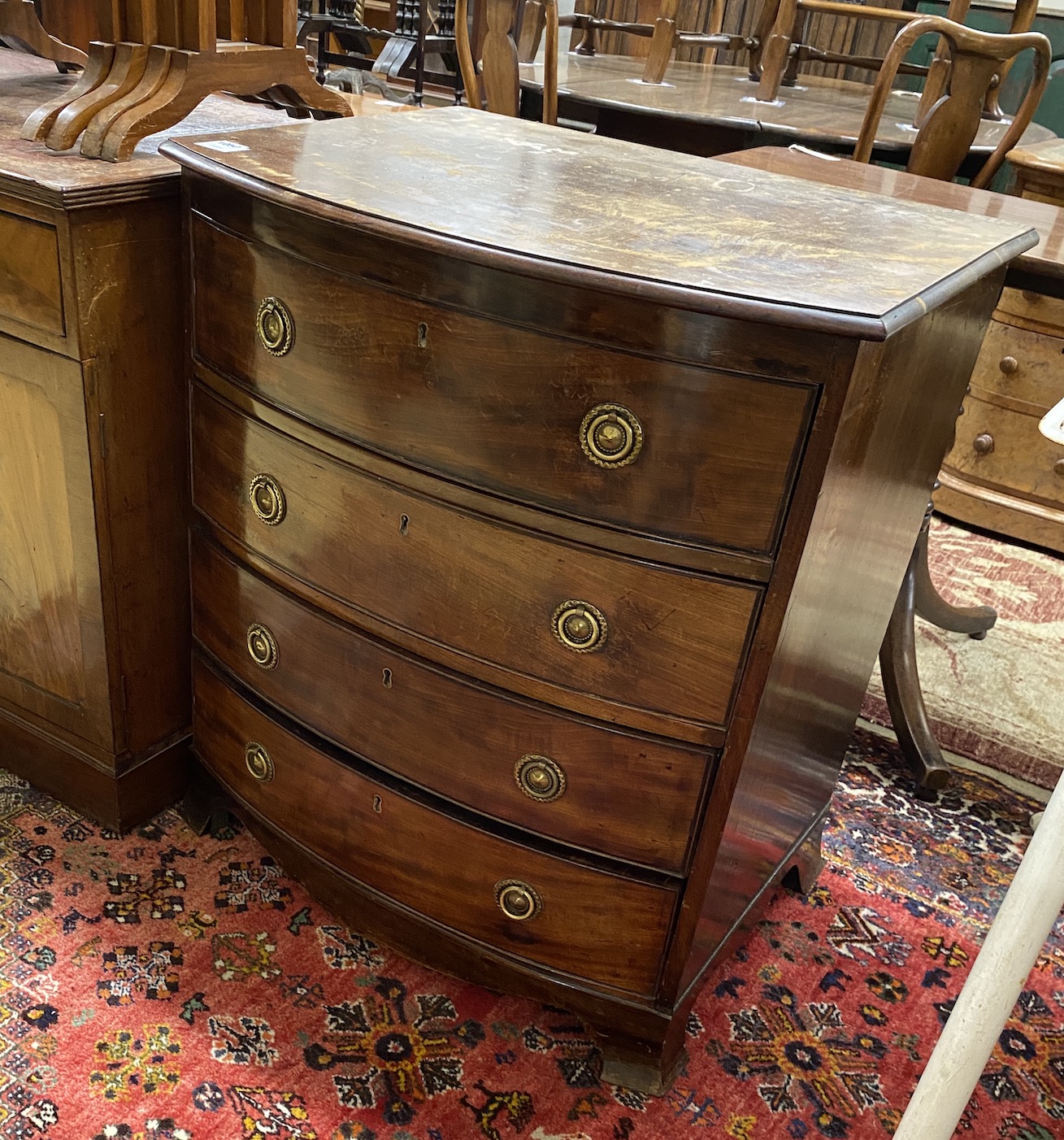 A small Regency style mahogany bow front chest of drawers, width 70cm, depth 54cm, height 79cm